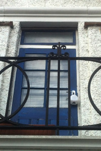 Jason Neylon's Air Quality Egg with a gas diffusion tube attached, hanging by the door of his first floor flat, July 2013