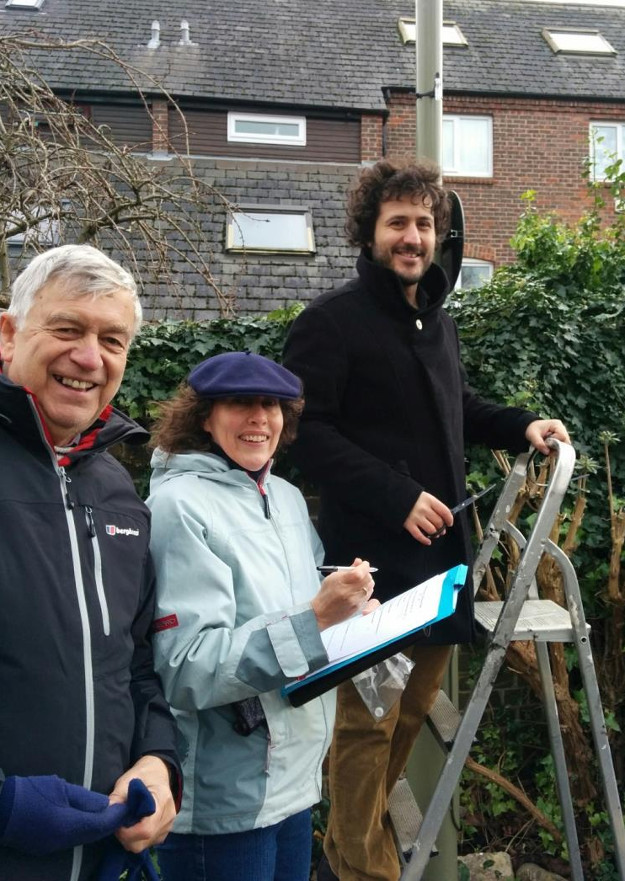 Dario Salvi from Oxford (up the ladder) sitting a air pollution monitor